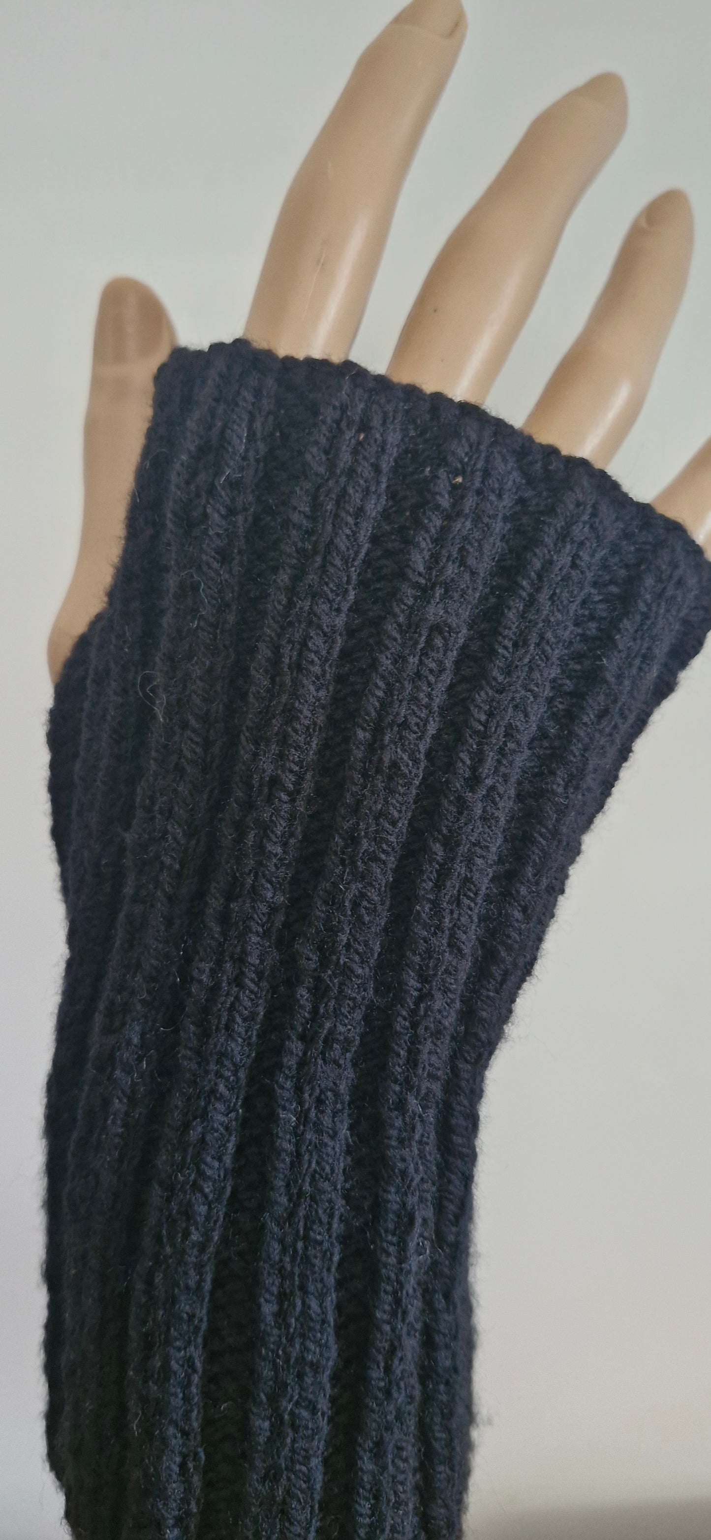 Black ribbed fingerless gloves