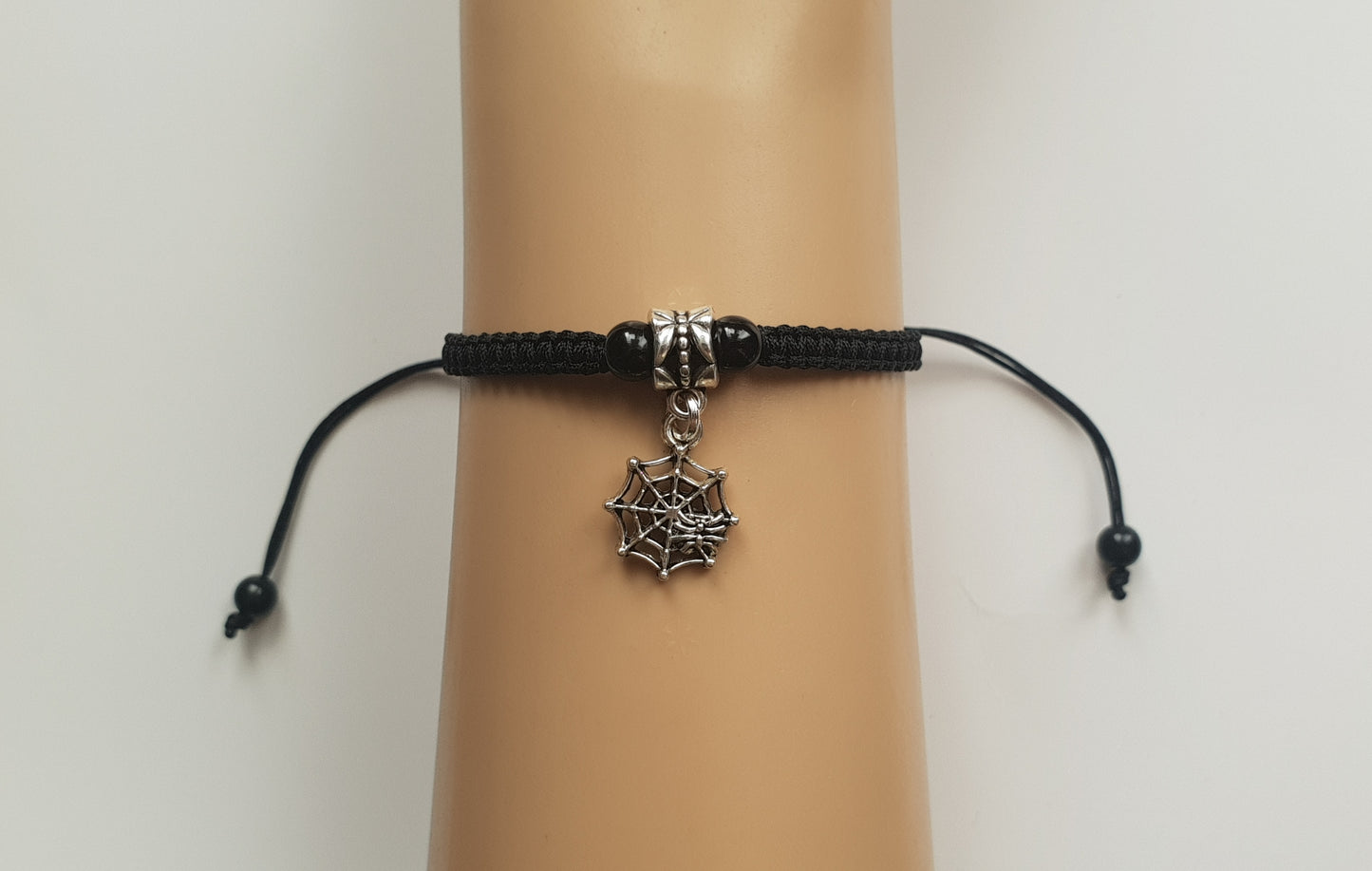 Spider web charm bracelet