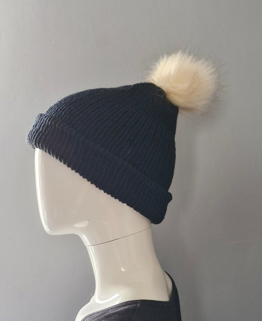 Black beanie hat with cream coloured pom pom