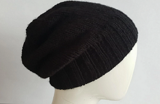 Black slouch beanie, hand knit using 100% acrylic yarn.