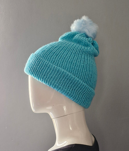 Blue beanie hat with light blue pom pom