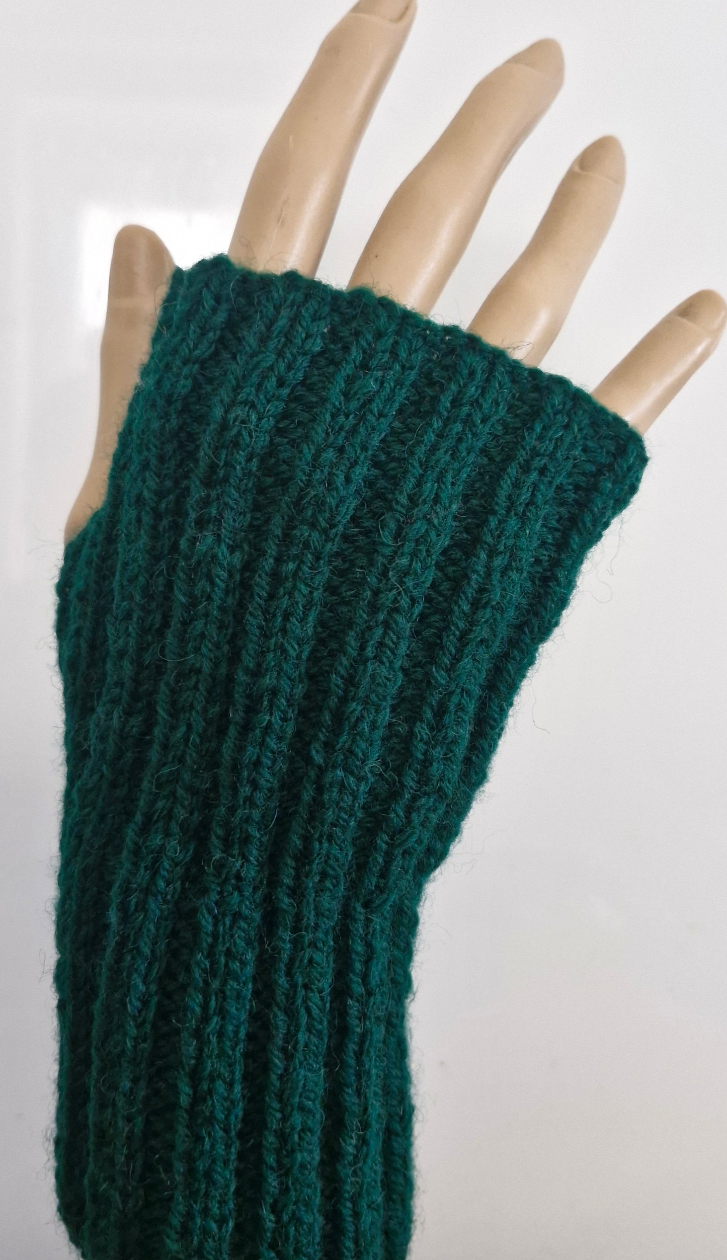 Green ribbed fingerless gloves