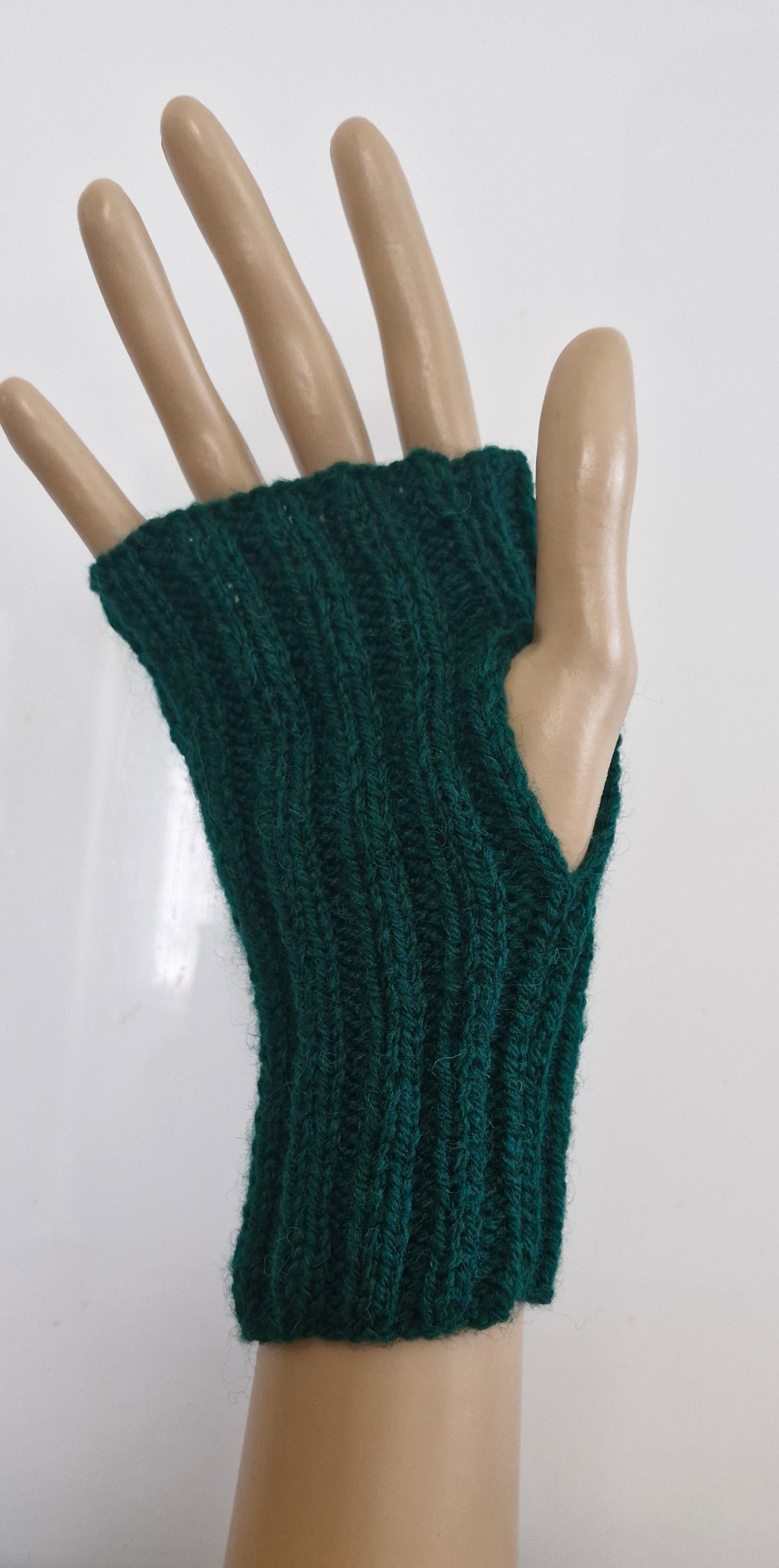 Green ribbed fingerless gloves